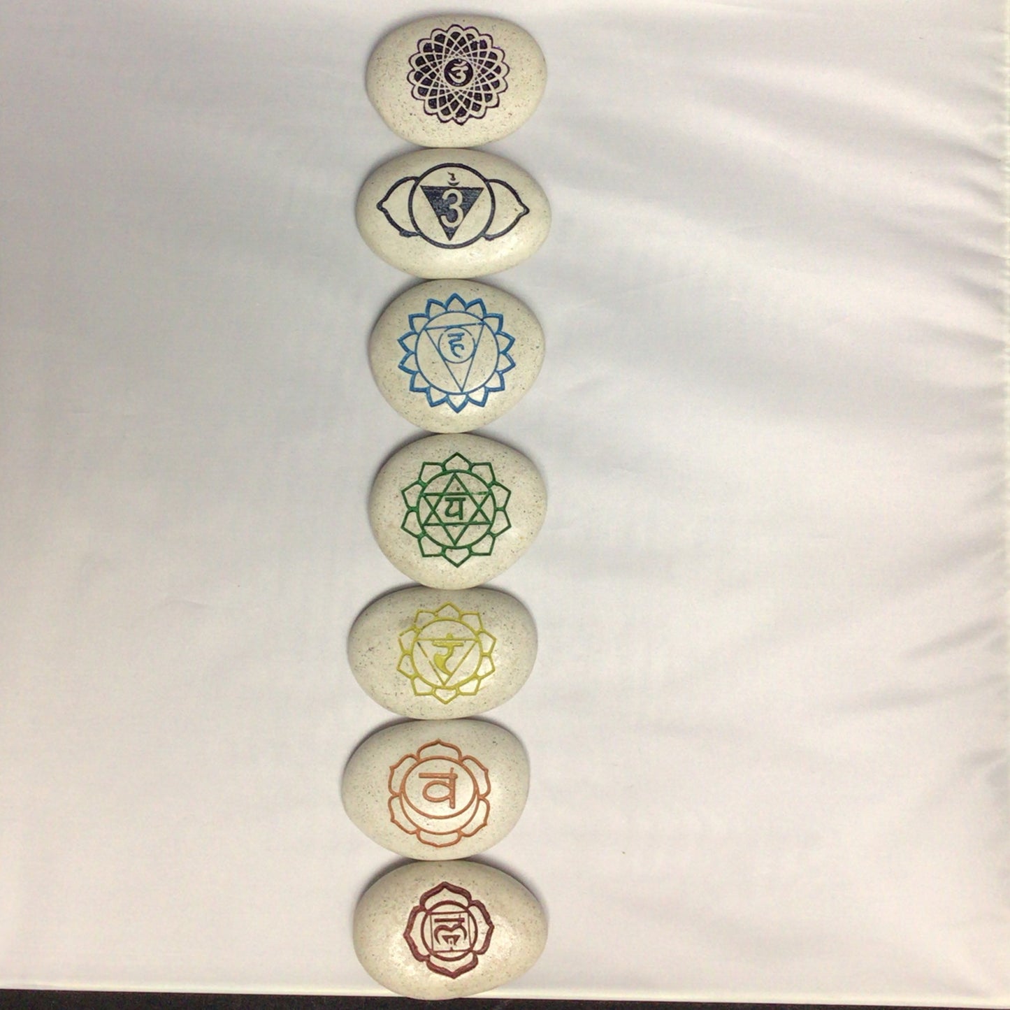 Engraved Chakra Palm Stone